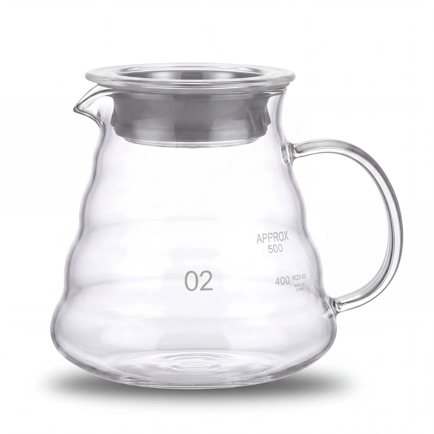 Carafe à café en verre borosilicate du kit, graduation intérieure visible, vue de face sur fond clair.