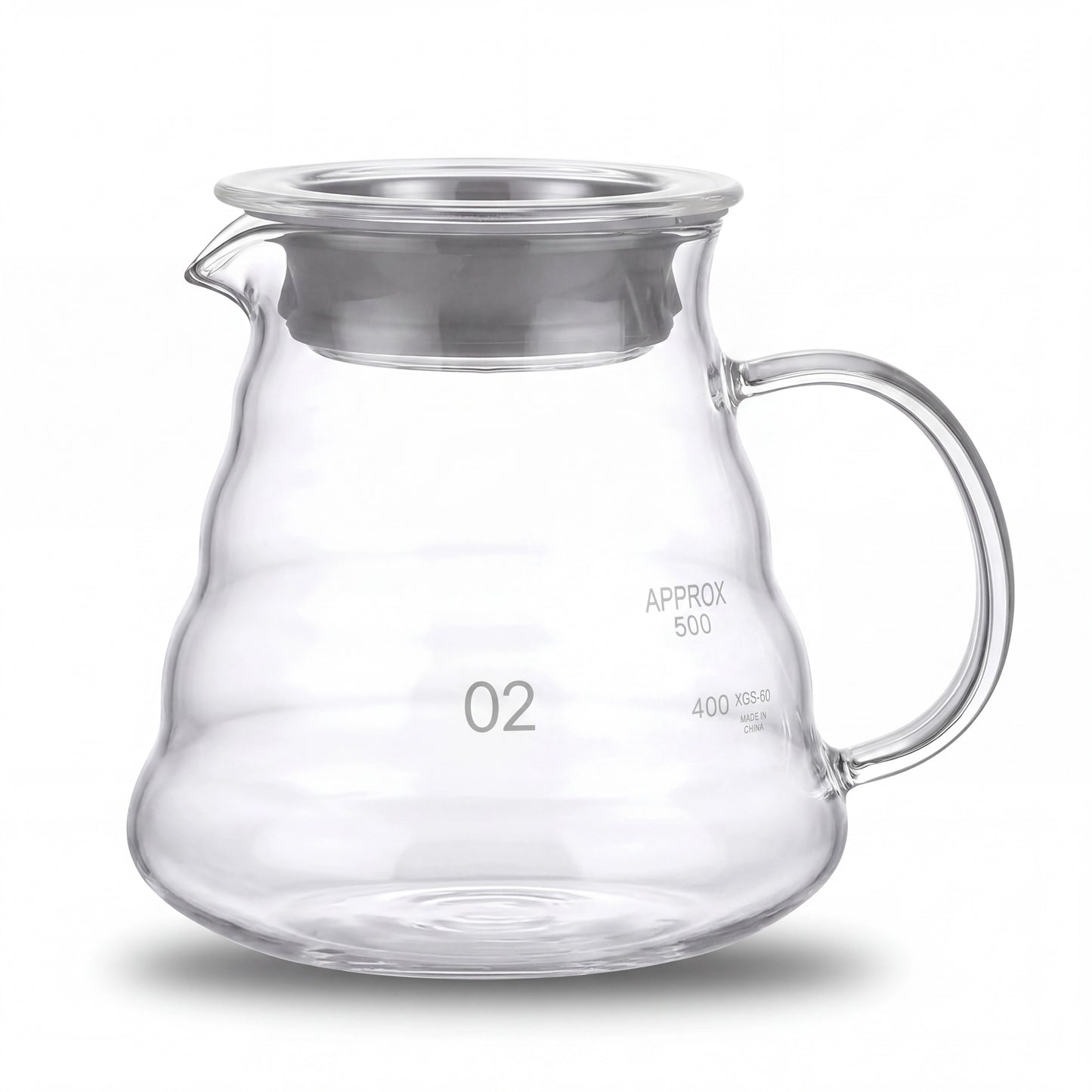 Carafe à café en verre borosilicate vide, graduation visible, vue de face sur fond clair.