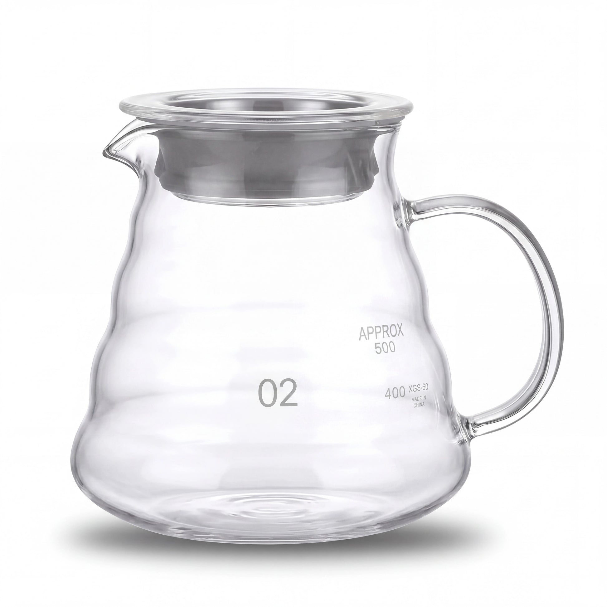 Carafe à café en verre borosilicate vide, graduation visible, vue de face sur fond clair.